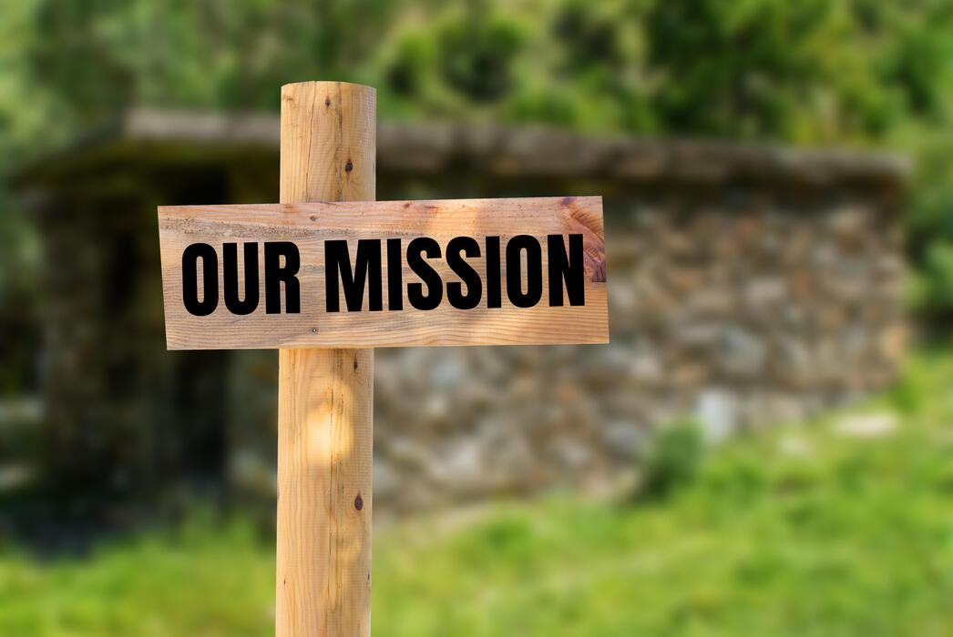 our-mission-message-written-on-wooden-sign-with-nature-background-conceptual-our-mission-symbol-copy-space-photo